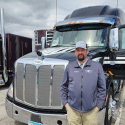 Aaron Puterbaugh, a driver for carrier Long Haul Trucking out of Minnesota, next to his 2021 Peterbilt 579 Ultraloft. Aaron Puterbaugh, a driver for carrier Long Haul Trucking out of Minnesota, next to his 2021 Peterbilt 579 Ultraloft.