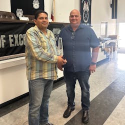 Driver Juan Vazquez (left) receives CPC's President's Award from Division Manager Ray Miles after saving a choking man's life with the Heimlich maneuver. Driver Juan Vazquez (left) receives CPC's President's Award from Division Manager Ray Miles after saving a choking man's life with the Heimlich maneuver.