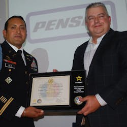 Lt. Col. Jesse Ceja (left) and Penske Transportation Solutions VP of Staffing Ron Schwartz hold a certificate of partnership for the PaYS program.