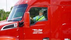 Charles Smith, DMC Insurance&apos;s Driver of the Year, in his truck for FirstFleet.