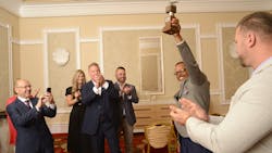 Kenneth Tolliver hoists the prestigious William A. Usher Sr. championship trophy in celebration alongside G&D Trucking/Hoffman Transportation leaders after winning NTTC's 2022-23 Professional Tank Truck Driver of the Year award. Kenneth Tolliver hoists the prestigious William A. Usher Sr. championship trophy in celebration alongside G&D Trucking/Hoffman Transportation leaders after winning NTTC's 2022-23 Professional Tank Truck Driver of the Year award.