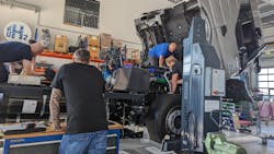 Quantron engineers work on a heavy-duty hydrogen fuel-cell truck at its Augsburg, Germany, headquarters. The hydrogen tanks can be seen along beneath the chassis. Quantron engineers work on a heavy-duty hydrogen fuel-cell truck at its Augsburg, Germany, headquarters. The hydrogen tanks can be seen along beneath the chassis.