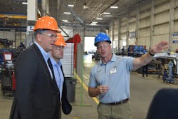 Stoughton Trailers CEO Bob Wahlin explains the chassis production line to committee members Rep. Darin LaHood (R-Ill.) (left) and its chairman, Rep. Mike Gallagher (R-Wis.) (center). Stoughton Trailers CEO Bob Wahlin explains the chassis production line to committee members Rep. Darin LaHood (R-Ill.) (left) and its chairman, Rep. Mike Gallagher (R-Wis.) (center).