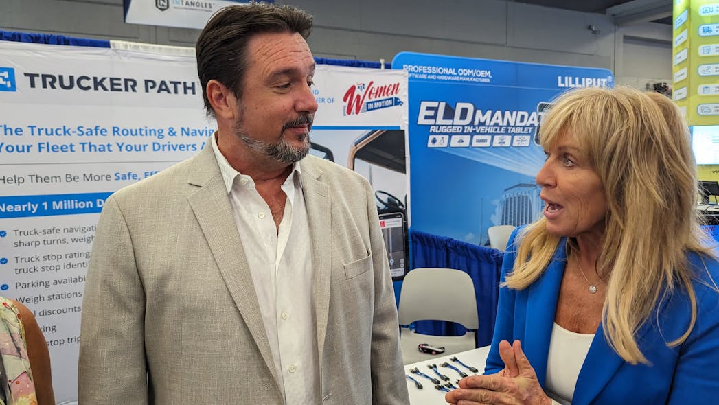 Trucker Path&apos;s Chris Oliver, left, and Women in Motion&apos;s Brenda Neville discuss their partnership during American Trucking Associations&apos; 2023 Management Conference &amp; Exhibition in Austin, Texas.