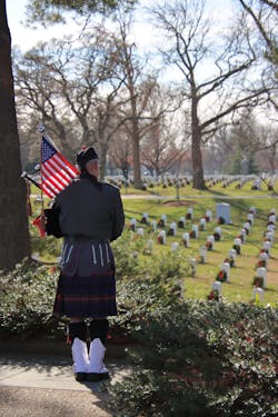 A bagpiper plays at Arlington National Cemetery.