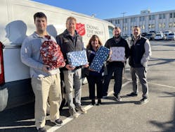 On a beautiful December day, Transervice employees deliver presents to the Salvation Army in New York.
