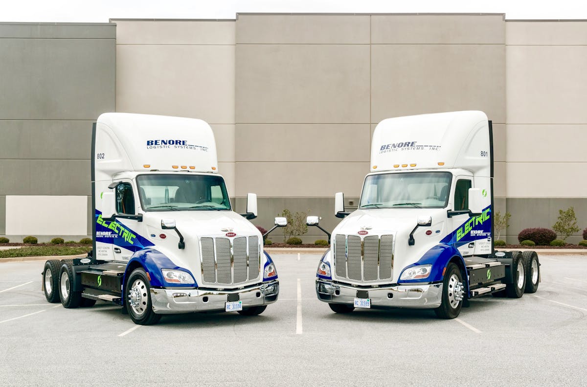 Two of Benore Logistic Systems&apos; Peterbilt 579EVs