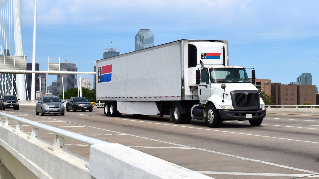 65cceedda36c6e001eade06a Plm Fleet Truck On Highway