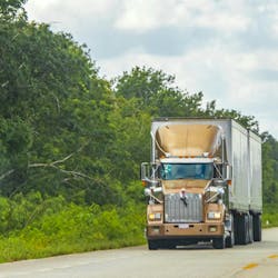 A Class 8 vehicle transports goods in Tulum Quintana Roo, Mexico. A Class 8 vehicle transports goods in Tulum Quintana Roo, Mexico.