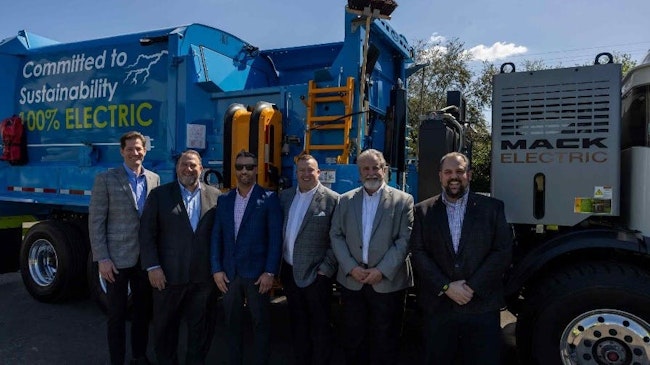 Pictured left to right are Darren Jane, Mack senior district manager, Southeast; Jonathan Randall, president of Mack Trucks North America; Brendon Pantano, CEO of Coastal Waste & Recycling; Tyler Ohlmansiek, Mack director of e-mobility sales; Dennis McDaniel, Mack Regional VP, Southeast; and Ryan Saba, Mack e-mobility energy solutions manager.