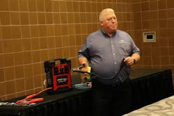 Vanair Director of Sales Jeff Steer with a Start&bull;All Jump&bull;Pack12/24V demonstrates a jump-starting clamp&apos;s usage.