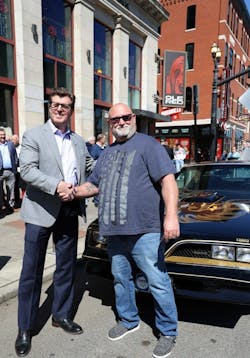 Ambest president &amp; CEO Chuck Ryan &amp; Stacey Hamilton pictured on Broadway, in front of Ole Red and the 2023 Grand Prize, 1978 Pontiac Firebird Trans Am.