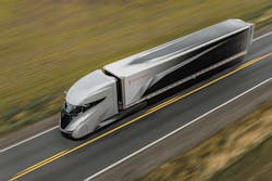 The truck features a futuristic look that resembles a bullet train. It also features a center driving position, and it even has a sleeper compartment, complete with a sofa and a murphy bed that folds down to accommodate long hauls.