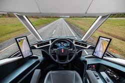 The cab of the Kenworth SuperTruck 2 features a center driving position with lower windows for visibility. The cab of the Kenworth SuperTruck 2 features a center driving position with lower windows for visibility.