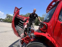 The Eaton and BAE electric powertrain eliminates multiple components, simplifying the electric powertrain. This simplification makes room for Brian Kovalchick, BAE Systems senior technician, to stand under the hood. The Eaton and BAE electric powertrain eliminates multiple components, simplifying the electric powertrain. This simplification makes room for Brian Kovalchick, BAE Systems senior technician, to stand under the hood.