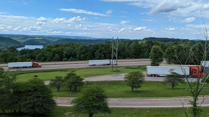 Trucks travel along Interstate 68 in western Maryland. The summertime brings out more passenger car drivers, which can make the jobs of professional drivers more difficult on highways.