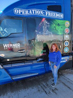Gina Jones in front of a Werner Enterprises Operation Freedom Fleet truck Gina Jones in front of a Werner Enterprises Operation Freedom Fleet truck