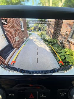 When backing out of my driveway, I had to rely on the help of others to guide me instead of using the truck’s backup camera. This is because the lines on the monitor that represent the path of the truck’s tires were several inches to a foot from the tires’ actual location (shown on previous photo). When backing out of my driveway, I had to rely on the help of others to guide me instead of using the truck’s backup camera. This is because the lines on the monitor that represent the path of the truck’s tires were several inches to a foot from the tires’ actual location (shown on previous photo).