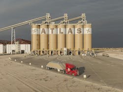 Proppant sand hauled by Atlas Energy Solutions by Kodiak trucks is used with fracturing fluid during hydraulic fracking to keep ground fractures open for energy extraction. Proppant sand hauled by Atlas Energy Solutions by Kodiak trucks is used with fracturing fluid during hydraulic fracking to keep ground fractures open for energy extraction.