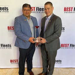 Grand Island Express's Jim Pirnie, president, and Deen Albert, VP of Operations, hold an award for placing in the Best Fleets to Drive for Hall of Fame. Grand Island Express's Jim Pirnie, president, and Deen Albert, VP of Operations, hold an award for placing in the Best Fleets to Drive for Hall of Fame.