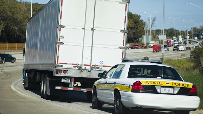law enforcement pulling over heavy-duty truck