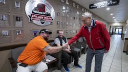 Gene England greets some of his fleet's drivers during a visit to the C.R. England headquarters in Salt Lake City earlier this decade. Gene England greets some of his fleet's drivers during a visit to the C.R. England headquarters in Salt Lake City earlier this decade.