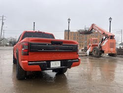 2025 Nissan Frontier Pro-4X in front of construction equipment 2025 Nissan Frontier Pro-4X in front of construction equipment
