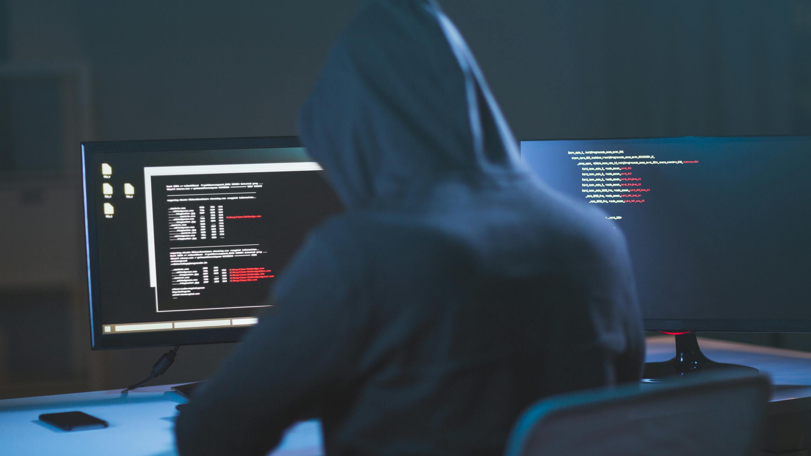 hacker sitting at computer about to attack a trucking company