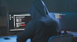 hacker sitting at computer about to attack a trucking company hacker sitting at computer about to attack a trucking company