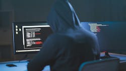 hacker sitting at computer about to attack a trucking company hacker sitting at computer about to attack a trucking company