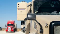 Two Kodiak RoboTrucks are parked in the Permian Basin, where Atlas Energy Solutions provides proppant fracking material for oil and natural gas extraction. Two Kodiak RoboTrucks are parked in the Permian Basin, where Atlas Energy Solutions provides proppant fracking material for oil and natural gas extraction.