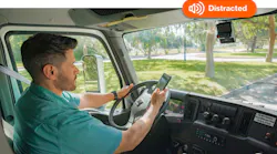 man driving distracted with distraction alert