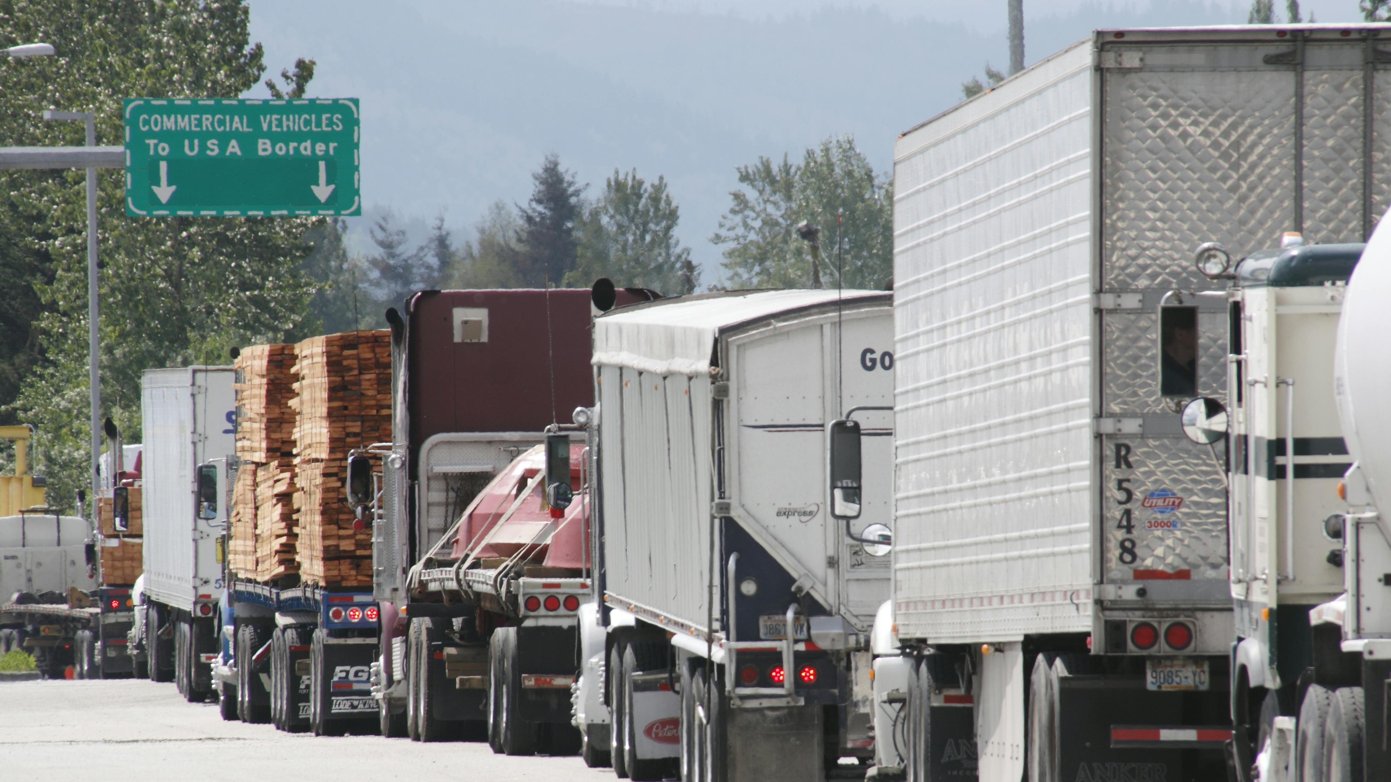 trucks wait at U.S.-Canada border crossing