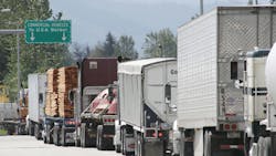 trucks wait at U.S.-Canada border crossing trucks wait at U.S.-Canada border crossing