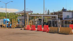truck crossing Canadian border checkpoint truck crossing Canadian border checkpoint