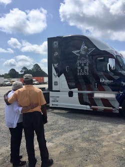 Dedicated Logistics surprised an employee, whom they call 'Shimp,' with a wrapped truck. The employee, a veteran, hugged Riels in thanks. Dedicated Logistics surprised an employee, whom they call 'Shimp,' with a wrapped truck. The employee, a veteran, hugged Riels in thanks.