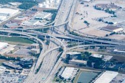Aerial view of the interchange of Sam Houston Tollway, Texas State Route 8, and Interstate 45 junction in Harris County, Texas near George Bush Intercontinental Airport. The U.S. Interstate System was officially completed during President Bush's administration in 1992. Aerial view of the interchange of Sam Houston Tollway, Texas State Route 8, and Interstate 45 junction in Harris County, Texas near George Bush Intercontinental Airport. The U.S. Interstate System was officially completed during President Bush's administration in 1992.