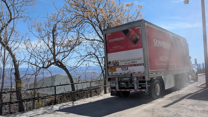 A regional delivery truck operates among the mountains in Jerome, Arizona.