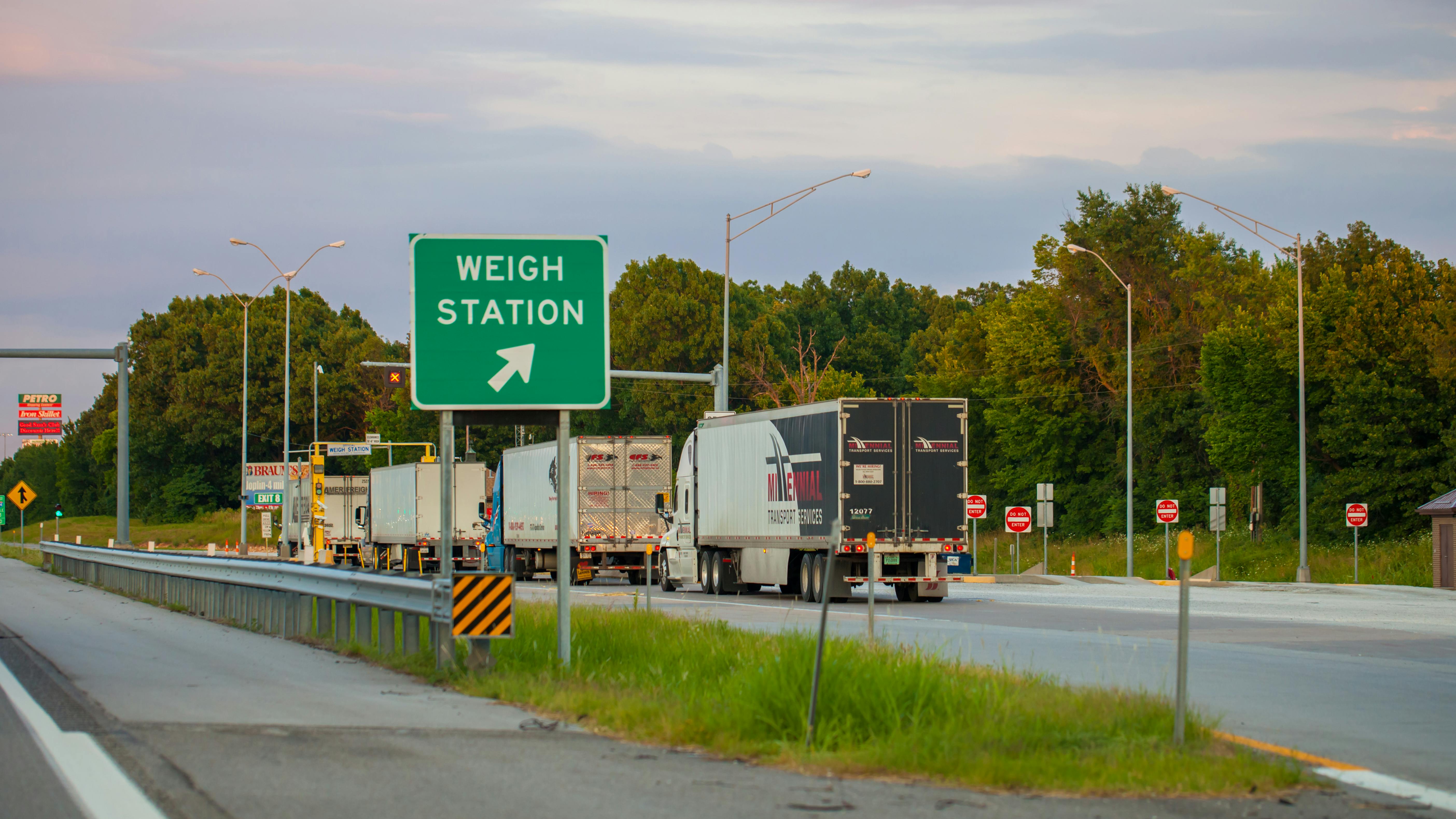 Semi trucks line up at a weigh station outside Joplin, Missouri. During International Roadcheck, thousands of commercial vehicles will be inspected by enforcement officers across North America.
