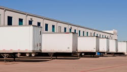 trailers in a warehouse lot trailers in a warehouse lot