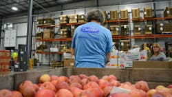 6841b041f9ad63b2c5a50ed4 A Carrier Employee Volunteers At The Food Bank Of 6841b041f9ad63b2c5a50ed4 A Carrier Employee Volunteers At The Food Bank Of