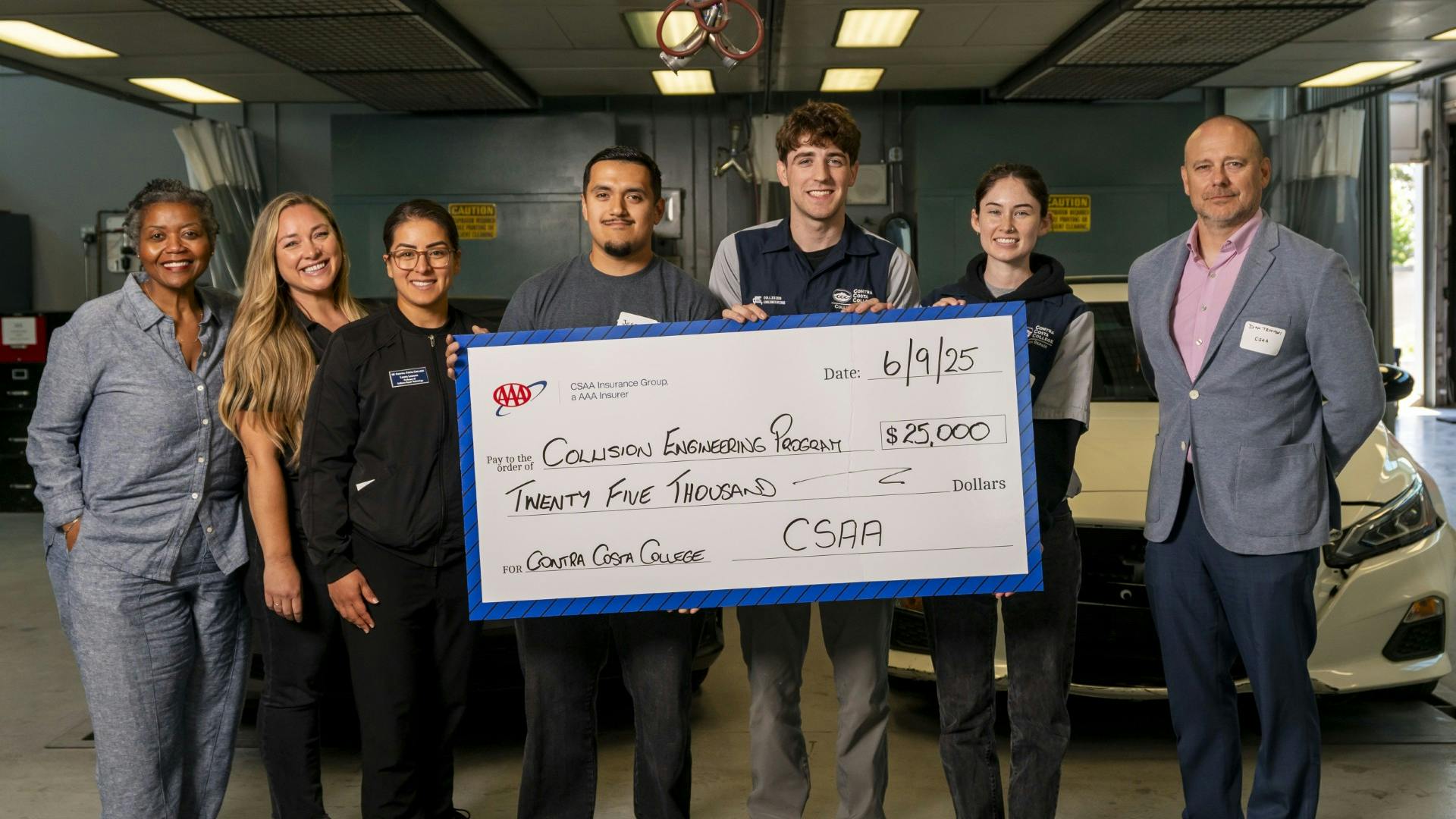 Officials from CSAA gathered with the Collision Engineering Career Alliance, Contra Costa administration, and Collision Engineering students for a check presentation.