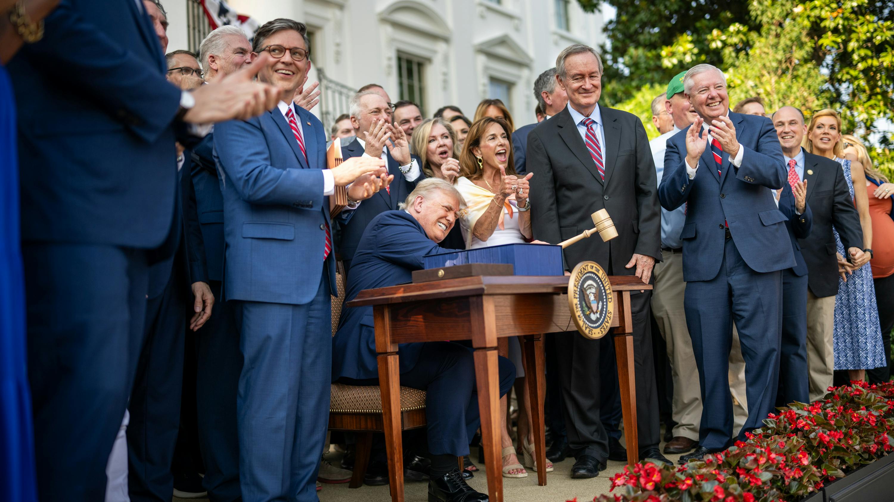 President Donald Trump signs the 'Big Beautiful Bill' legislation during a July 4, 2025, ceremony at the White House.