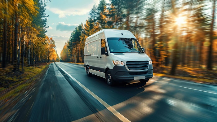 electric cargo van driving in summertime