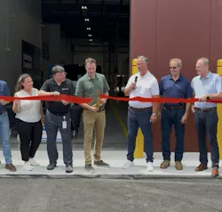 Employees and Leadership from Fleet Services by Cox Automotive gather for a ribbon cutting.