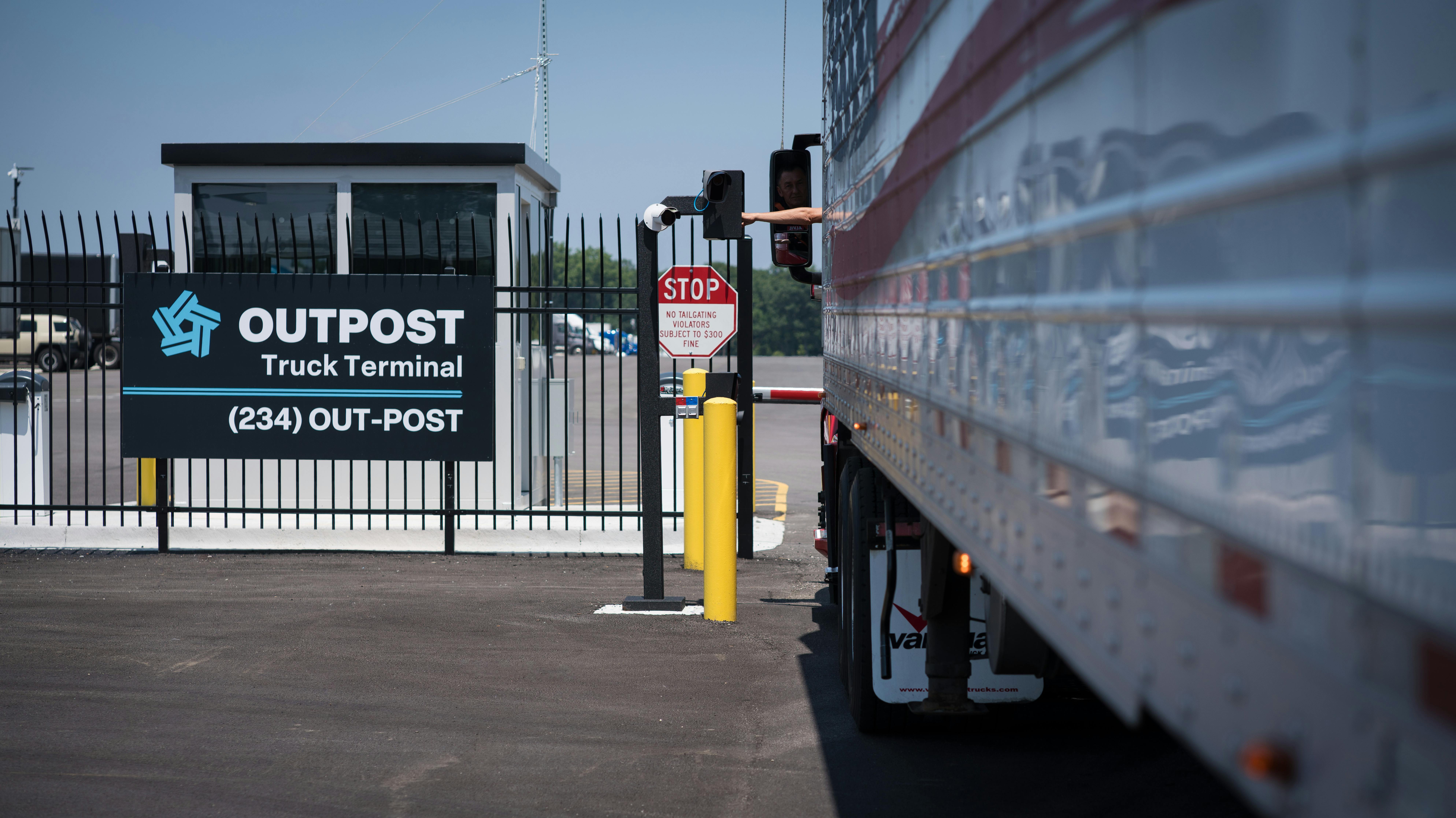 Driver interacting with kiosk at Outpost gate