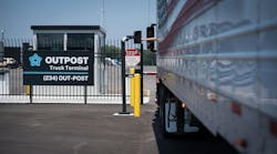 Driver interacting with kiosk at Outpost gate Driver interacting with kiosk at Outpost gate