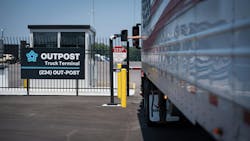 Driver interacting with kiosk at Outpost gate Driver interacting with kiosk at Outpost gate