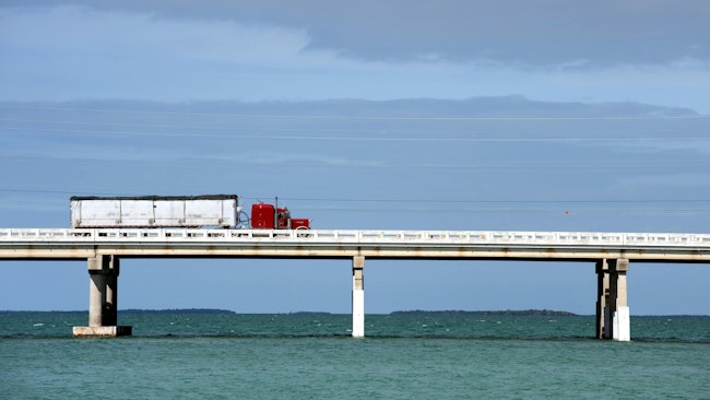 Semi truck on bridge over water in the Florida Keys