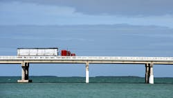 Semi truck on bridge over water in the Florida Keys Semi truck on bridge over water in the Florida Keys